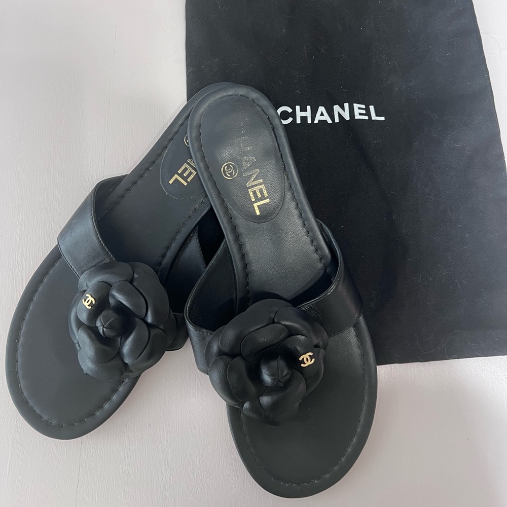 Chanel Camellia black lamb skin sandals in excellent, gently used condition.